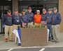 American Legion Post 370 members give away poppies and collect donations for the American Legion Child Welfare Fund at Bryson's Grocery in Highlands.